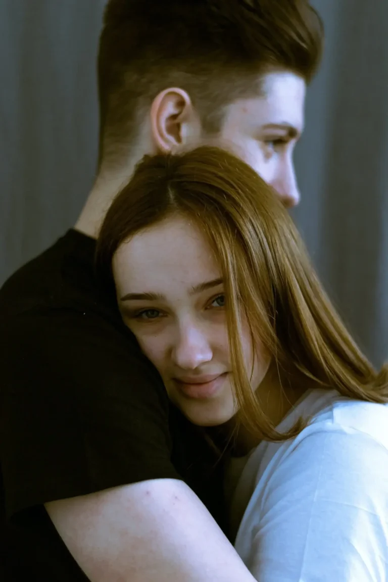 man and woman hugging